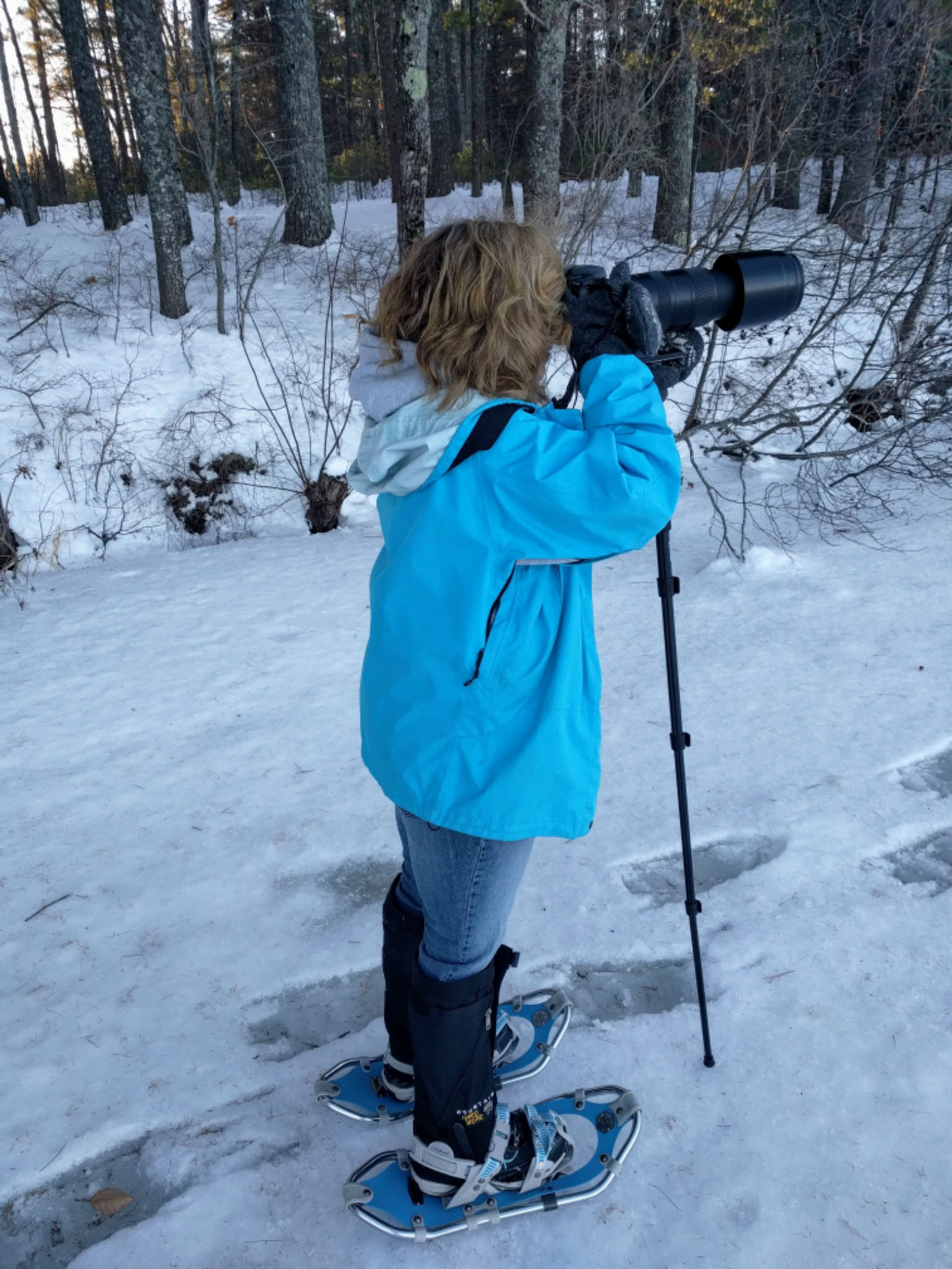 Tamra snowshoeing with her camera