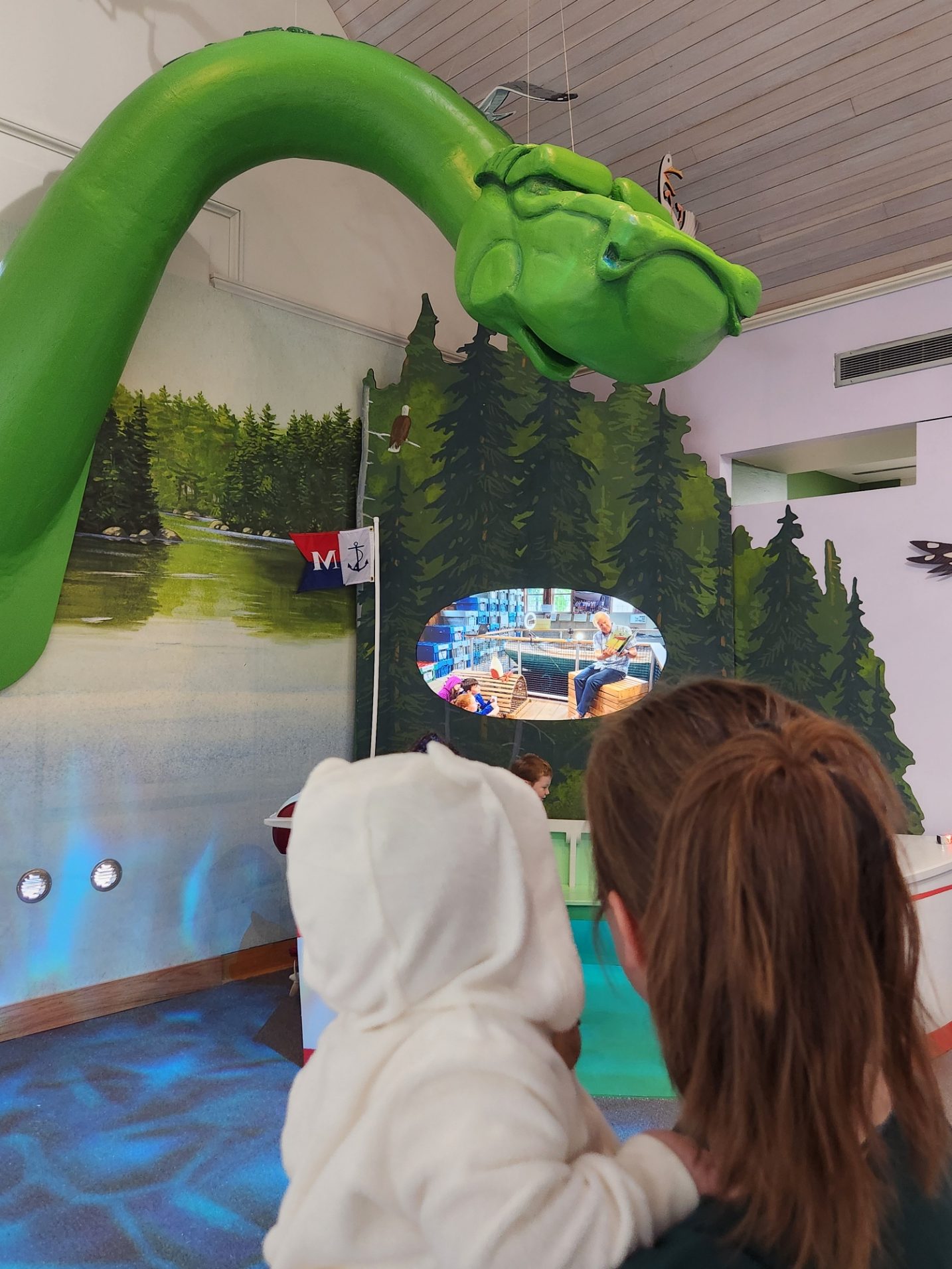 A giant sculpture of Hudson, a lake monster character from Hattie and Hudson